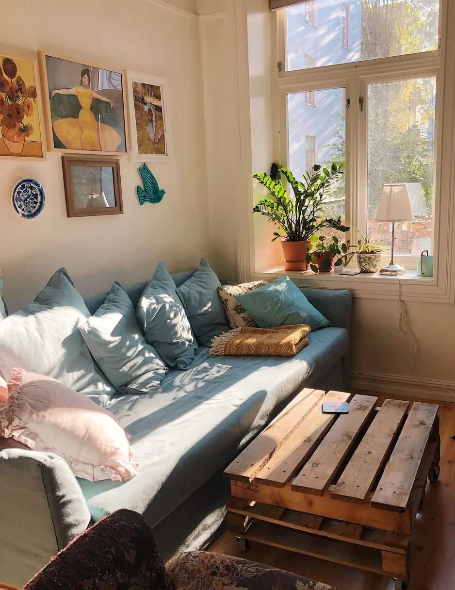 A sunlit living room with clear surfaces